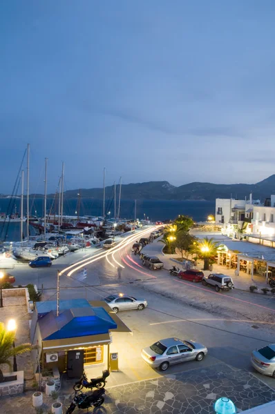 Adamas Milos Cyclades Greek island town at dusk waterfront harbo — Stock Photo, Image