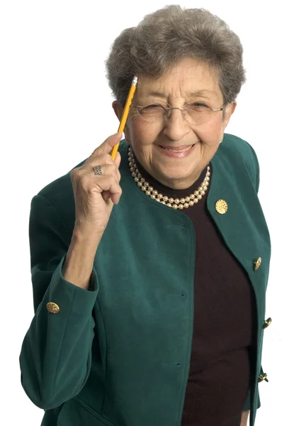 Healthy senior woman pointing to head — Stock Photo, Image