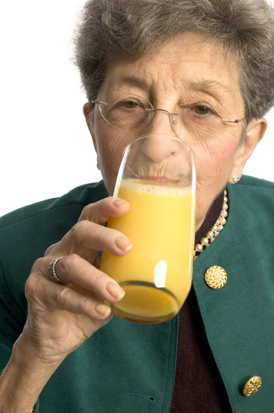 Woman drinking orange juice — Stock Photo, Image