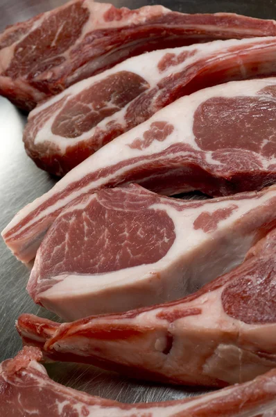 Rib lamb chops in frying pan — Stock Photo, Image