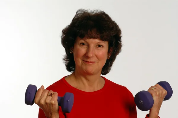 Beautiful woman in fitness gym — Stock Photo, Image