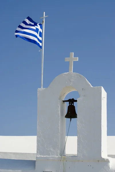 Greek island church and bells with flag — Stock Photo, Image