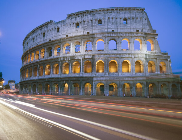 Colosseum rome italy night time with car light streaks tourists coliseum collosseum