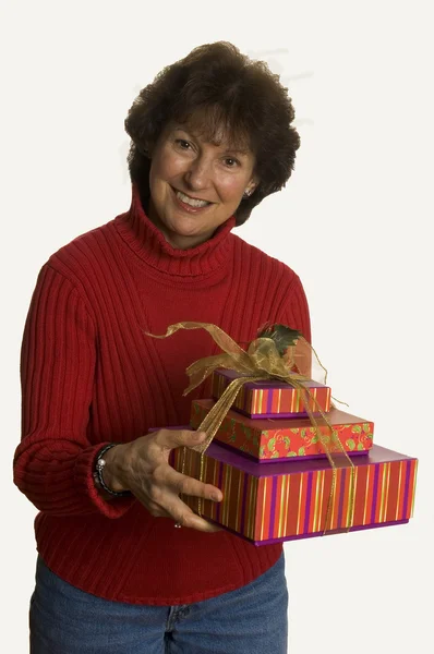 Happy woman with gifts stack — Stock Photo, Image