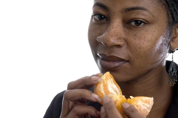 Woman with tangerine — Stock Photo, Image