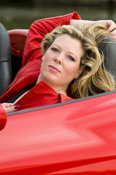 Woman red sports car — Stock Photo, Image