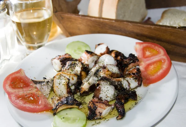 Greek island taverna specialty of marinated grilled octopus — Stock Photo, Image