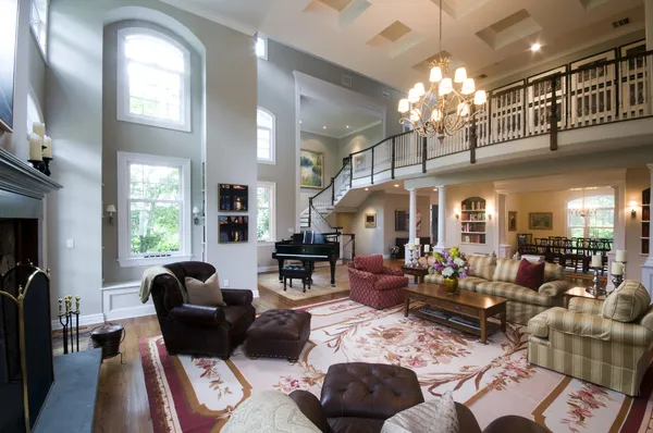 Large living room with leather chairs and fireplace — Stock Photo, Image