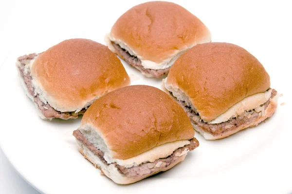 Mini hamburgers cheeseburgers with onions — Stock Photo, Image