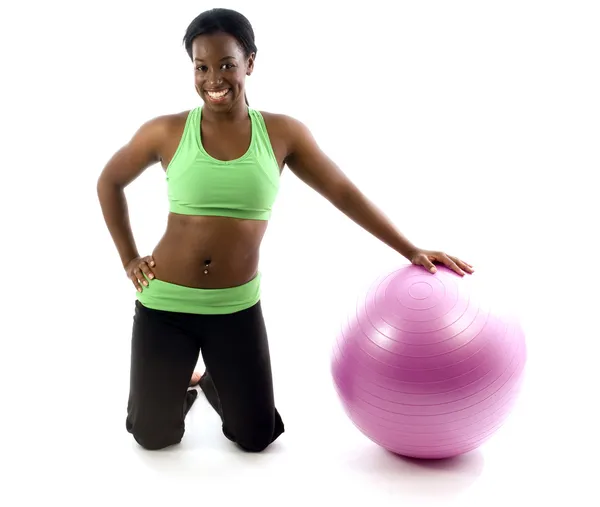 Young pretty hispanic african american woman exercising with fit ball — Stock Photo, Image