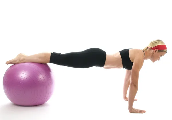 Strength pose middle age woman fitness core ball — Stock Photo, Image