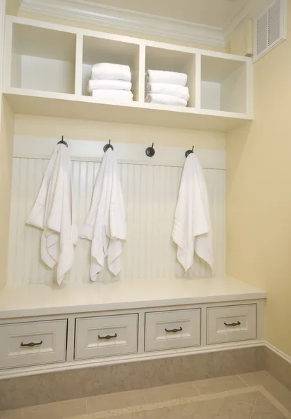 Locker room with bathrobes towels — Stock Photo, Image