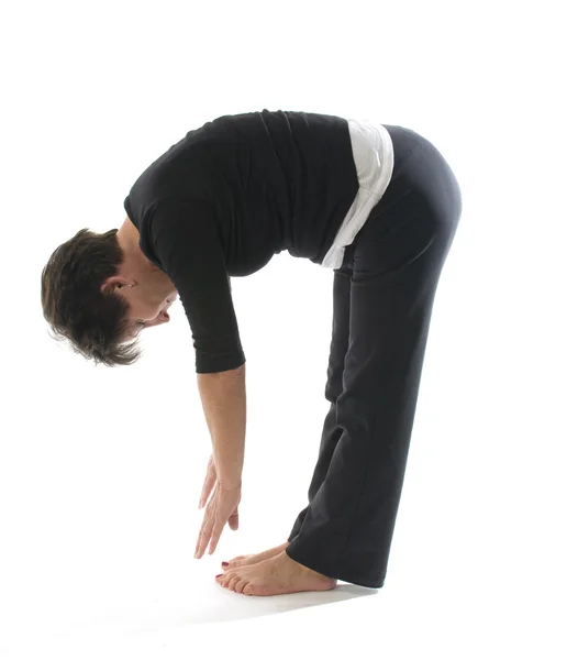 Female yoga position toe touch hamstring stretch — Stock Photo, Image