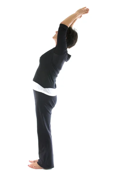 Middle age senior woman mountain tadasana yoga back stretch posi — Stock Photo, Image