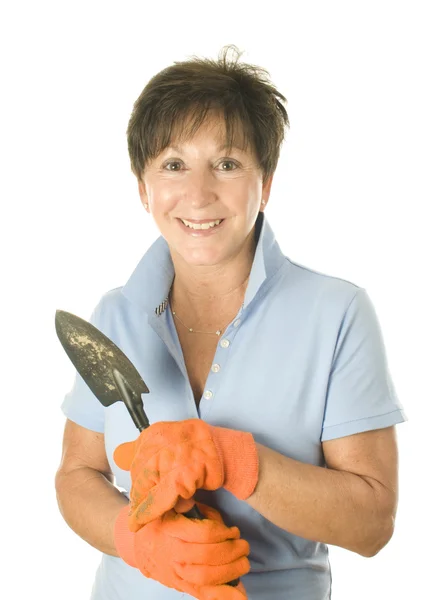 女性中年高级女园丁手工具锄头镘锹 — 图库照片