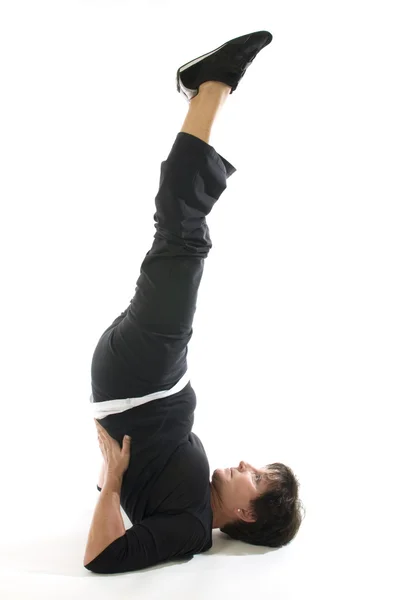 Middle age woman demonstrating yoga position half shoulderstand — Stock Photo, Image