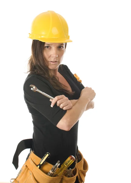 Female worker carpenter builder with tool belt and hard hat helm — Stock Photo, Image