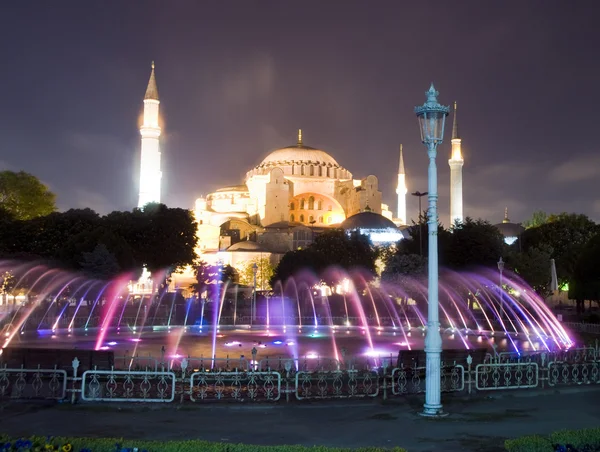 The Hagia Sophia mosque museum with fountain night scene with lights Istanbul Constantinople Turkey — Stock Photo, Image
