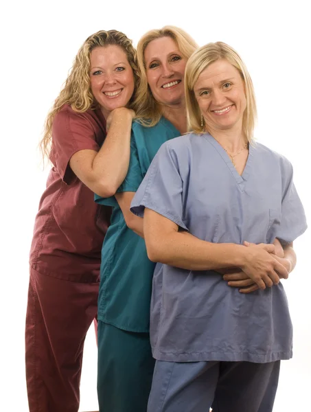 Three nurses in medical scrubs clothes — Stock Photo, Image