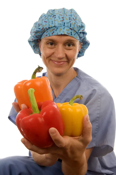 Zdravotní sestra nebo lékař lékařské žena s zdravé zeleniny — Stock fotografie