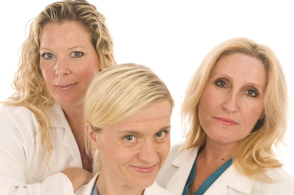 Τρεις Νοσοκόμοι-Νοσηλευτές ιατρική θηλυκά με ευτυχισμένη έκφραση — Φωτογραφία Αρχείου