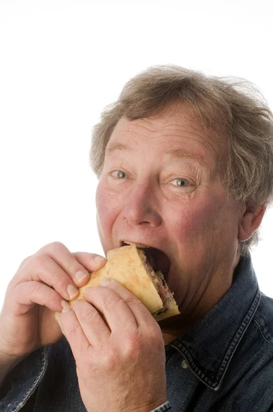 Man eating large sandwich — Stock Photo, Image