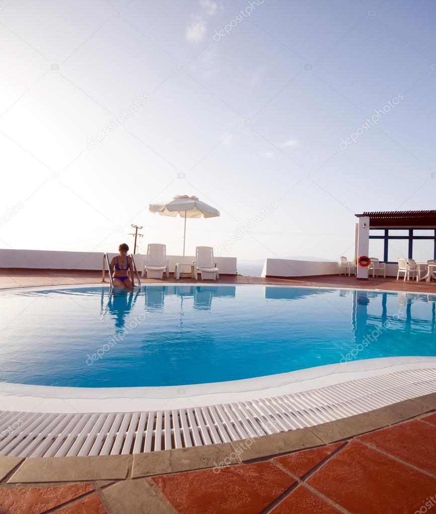 woman in swimming pool greek islands santorini