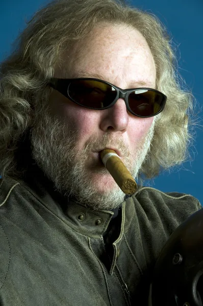 Handsome middle age man leather jacket smoking cigar — Stock Photo, Image