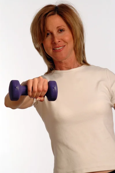 Beautiful woman in fitness gym — Stock Photo, Image