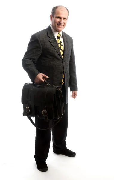 Senior corporate executive traveling with leather bag Stock Photo