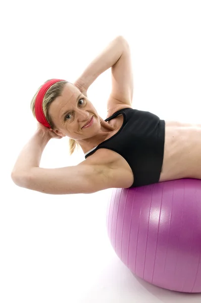 Sit ups strength pose middle age woman fitness core ball — Stock Photo, Image