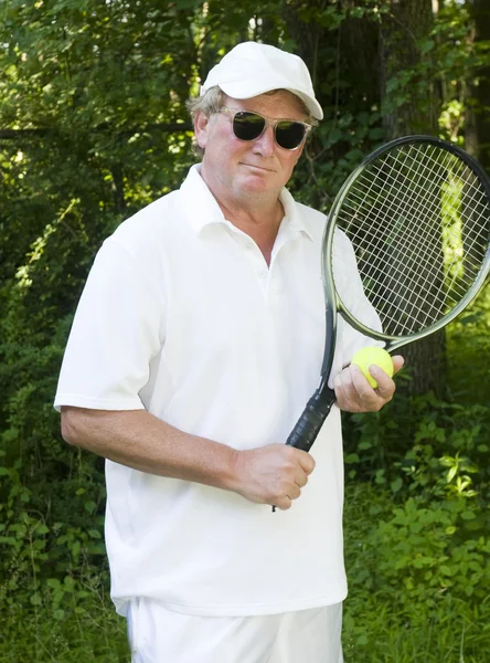 Middle age senior tennis player male demonstating stroke — Stock Photo, Image