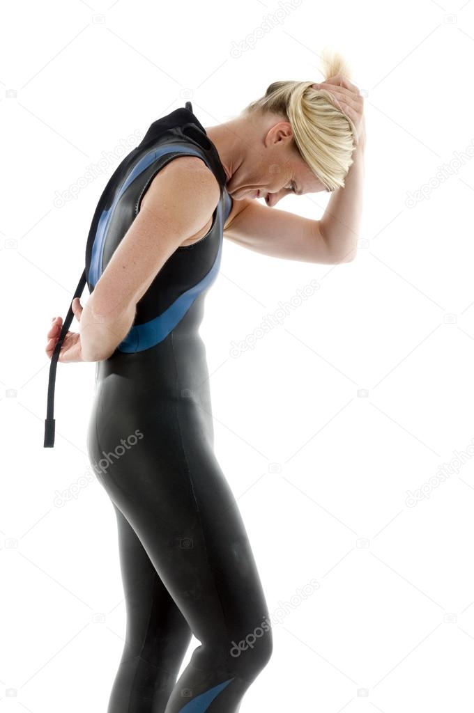 middle age female tri-athlete in swimming wet suit