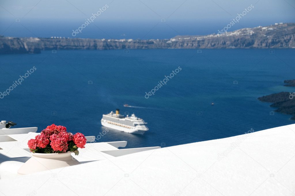 view of volcanic islands of santorini with cruise ship