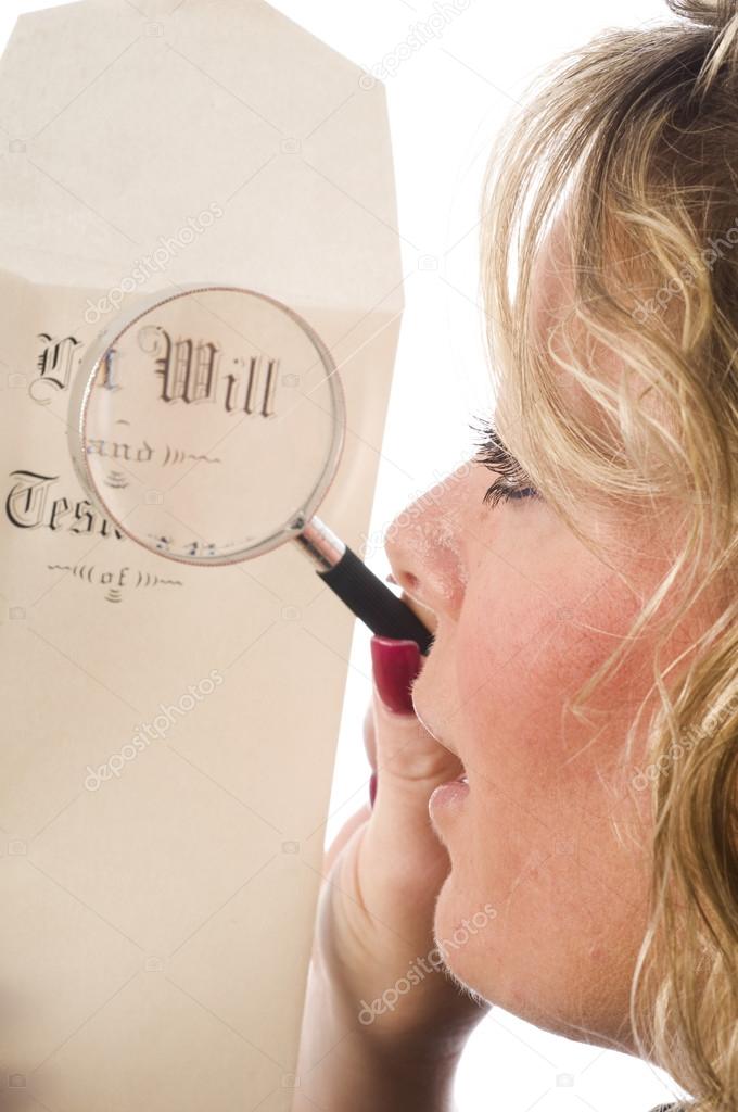 woman inspecting last will and testament