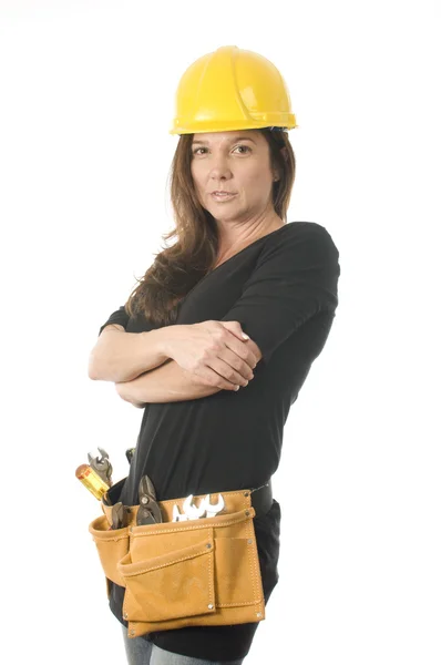 Female worker carpenter builder with tool belt and hard hat helm — Stock Photo, Image