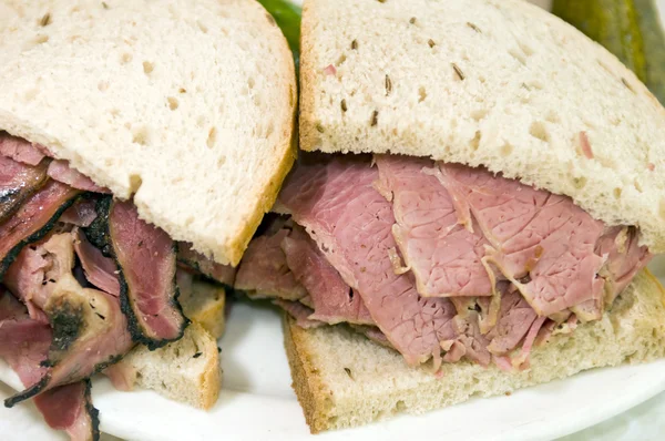 Combination pastrami corned beef on rye sandwich — Stock Photo, Image