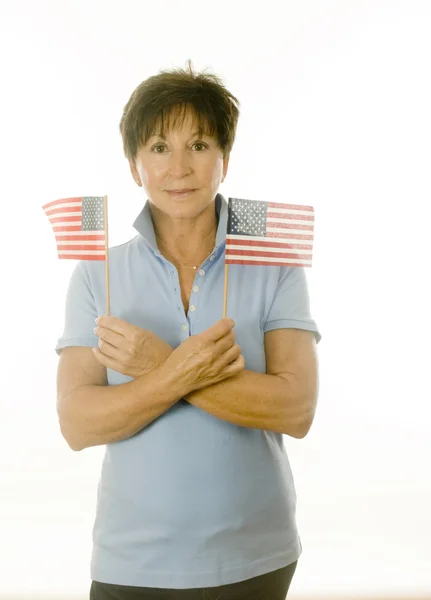 Female middle age senior patriotic American with flags — Stock Photo, Image