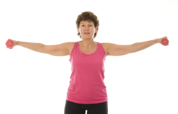 Senior middle age woman exercising with dumbbells — Stock Photo, Image