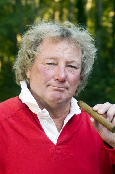 Senior man smoking big cigar — Stock Photo, Image