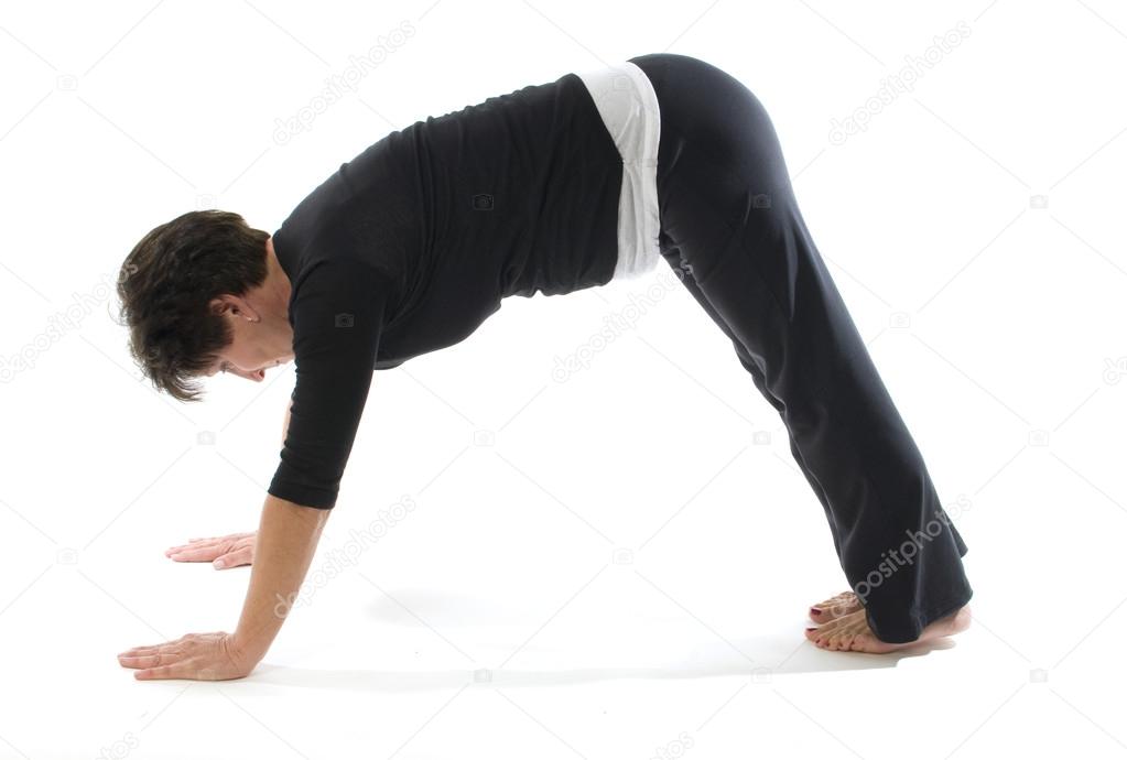 female yoga position downward facing dog pose
