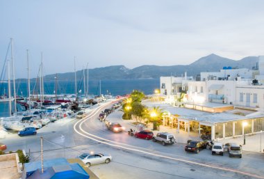 Adamas Milos Cyclades Greek island town at dusk waterfront harbor