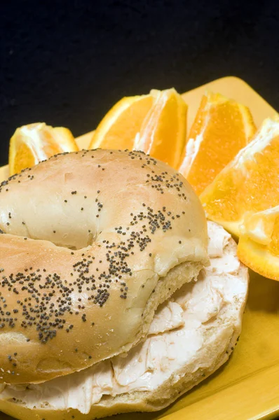 Poppy seed bagel with smoked salmon cream cheese spread fresh — Stock Photo, Image