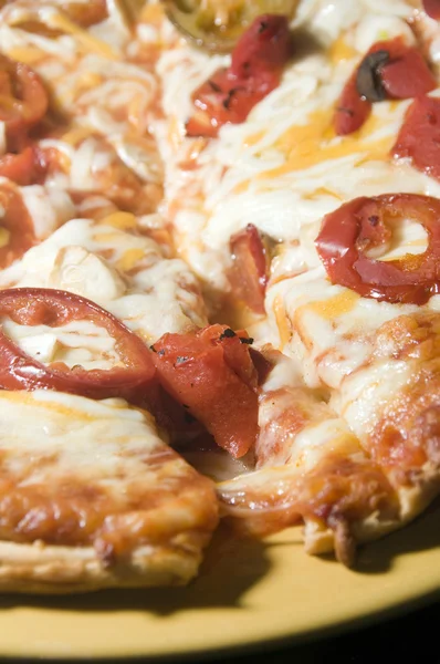 Cheese pizza homemade with roasted red peppers hot chilis garli — Stock Photo, Image