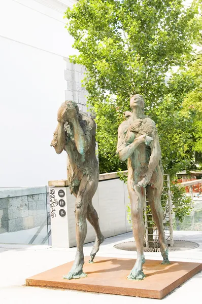 Sculpture statues Adam and Eve banished from paradise — Stock Photo, Image
