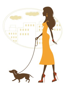 Dachshund ile yürüyen şık kadın