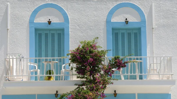 Traditional Greek Balcony with Blue Door Shutters and Bougainvillea — Stock Photo, Image