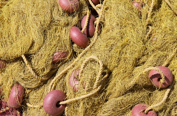 Close up of Yellow fishing nets with red floats — Stock Photo, Image