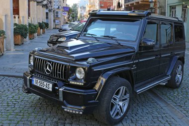 BATUMI,GEORGIA-DECEMBER 31:Luxury Vehicles parked at The Piazza Square. December 31,2021 in Batumi, Georgia.