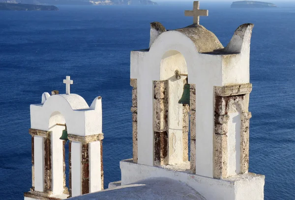 Orthodox Church Bell Towers Blue Aegean Sea Background Santorini Greece — Stockfoto